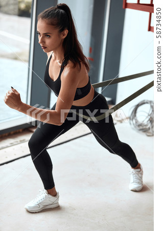 Young woman training cross fit Young woman training cross fit 58734850