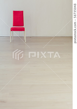 pink chair in the interior of an empty white room pink chair in the interior of an empty white room 58735048