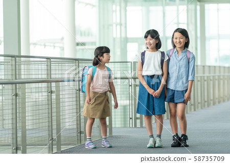 Elementary school student going to school Elementary school student going to school 58735709