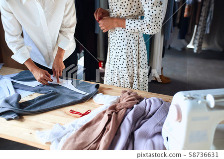 Closeup of young female working at designer studio 58736631