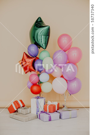 balloons of different colors with gifts for the holiday balloons of different colors with gifts for the holiday 58737340