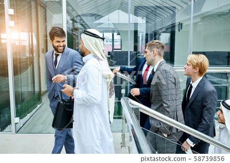 Business people discussing their ideas climbing stairs Business people discussing their ideas climbing stairs 58739856