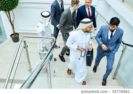 Sheikh and caucasian man speak Sheikh and caucasian man speak 58739862