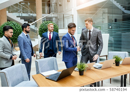 Young leaders of arabic and caucasian countries shaking hands Young leaders of arabic and caucasian countries shaking hands 58740194