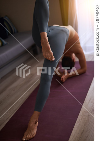 Young beautiful yogi woman practice yoga bridge 58740457