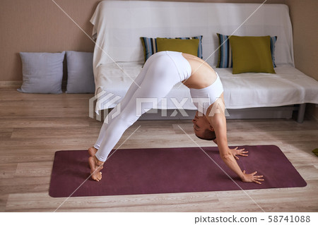 Fitness woman doing workout at home 58741088