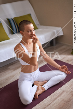 Portrait of caucasian beautiful young woman doing yoga Portrait of caucasian beautiful young woman doing yoga 58741143