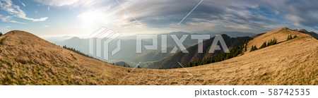 Beautiful sunset and layered mountain silhouettes 58742535