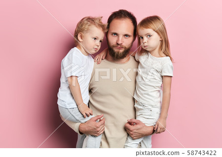 funny serious father and children making faces funny serious father and children making faces 58743422
