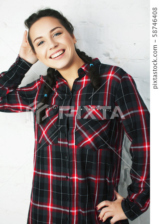 young pretty teenage modern hipster girl posing emotional happy isolated on white background young pretty teenage modern hipster girl posing emotional happy isolated on white background 58746408