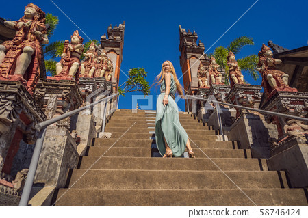 Young woman tourist in budhist temple Brahma Vihara Arama Bali Young woman tourist in budhist temple Brahma Vihara Arama Bali 58746424