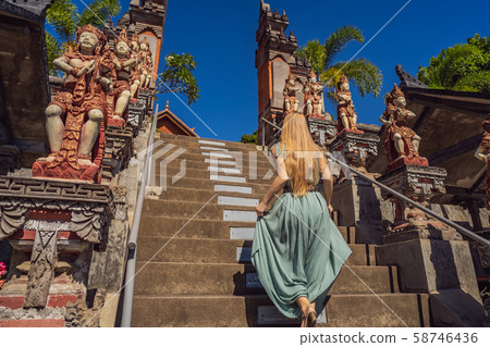 Young woman tourist in budhist temple Brahma Vihara Arama Bali Young woman tourist in budhist temple Brahma Vihara Arama Bali 58746436