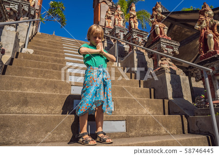 Young boy tourist in budhist temple Brahma Vihara Arama Bali Young boy tourist in budhist temple Brahma Vihara Arama Bali 58746445