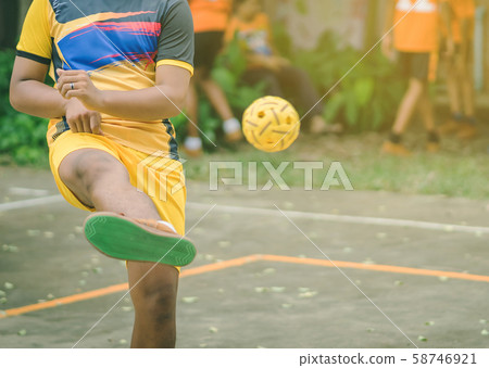 Students playing traditional asian sport game sepak takraw in school Students playing traditional asian sport game sepak takraw in school 58746921