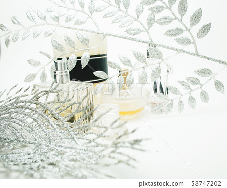 Jewelry table with lot of girl stuff on it, little mess in cosmetic brushes, women interior concept Jewelry table with lot of girl stuff on it, little mess in cosmetic brushes, women interior concept 58747202