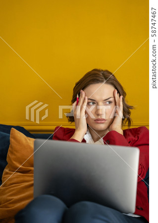 Dispirited modern young business lady looking away 58747467
