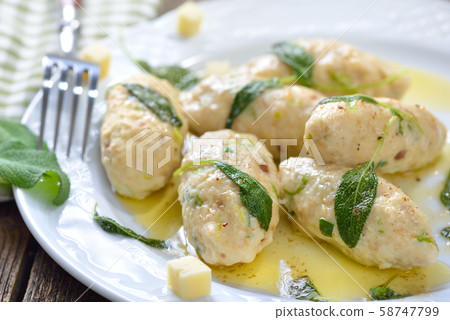 Tyrolean cheese dumplings (Kasnocken) served with butter and parmesan Tyrolean cheese dumplings (Kasnocken) served with butter and parmesan 58747799