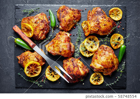 crispy fried Chicken Thighs on a stone tray 58748554