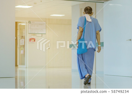 Male urinary tract patients walking for exercise and rest in the hospital 58749234