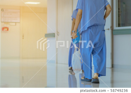 Male urinary tract patients walking for exercise and rest in the hospital Male urinary tract patients walking for exercise and rest in the hospital 58749236