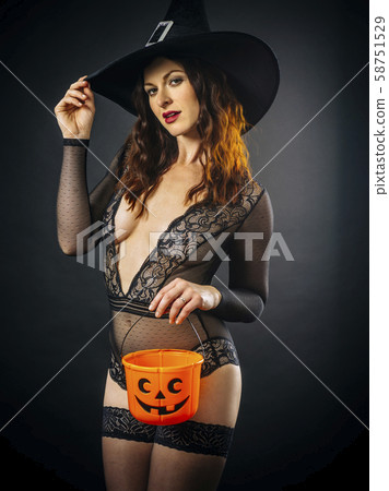 Sexy woman in lingerie holding Halloween pumpkin - Stock Photo [58751529] -  PIXTA
