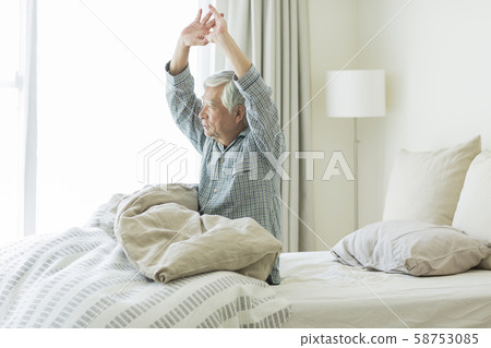 Senior man waking up Senior man waking up 58753085