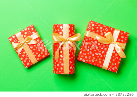 Top view woman holding Christmas present box with 58753286