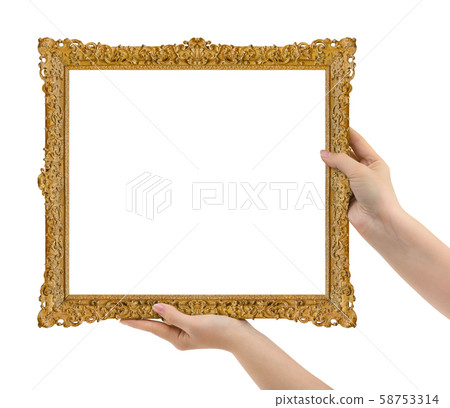 Wooden picture frame in hands Wooden picture frame in hands 58753314
