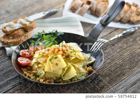 Austrian cuisine: Roasted square shaped pasta with bacon cracklings (so-called 'Grammelfleckerl') Austrian cuisine: Roasted square shaped pasta with bacon cracklings (so-called 'Grammelfleckerl') 58754812