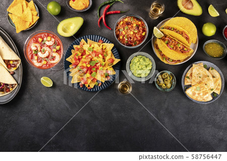 Mexican food, many dishes of the cuisine of Mexico, flat lay, shot from the top on a black 58756447
