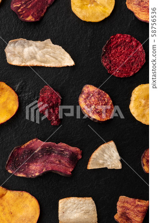 Dried fruit and vegetable chips, shot from above. Healthy vegan snack, an organic food flat lay 58756536