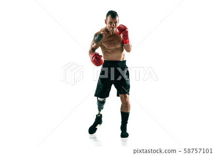Full length portrait of muscular sportsman with prosthetic leg, copy space. Male boxer in red gloves Full length portrait of muscular sportsman with prosthetic leg, copy space. Male boxer in red gloves 58757101