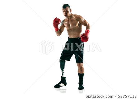 Full length portrait of muscular sportsman with prosthetic leg, copy space. Male boxer in red gloves 58757118