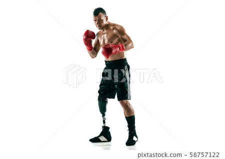 Full length portrait of muscular sportsman with prosthetic leg, copy space. Male boxer in red gloves 58757122