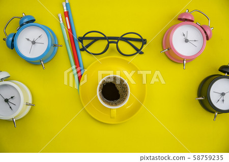 Top view of coffee cup with alarm clock,pencil Top view of coffee cup with alarm clock,pencil 58759235
