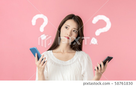 Women comparing smartphones 58761830