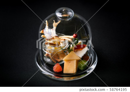 Assorted cheeses with berries and marmalade, mini serve in a glass flask. Fusion food concept, low 58764195