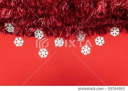 Christmas composition with tinsel on red Christmas composition with tinsel on red 58764865