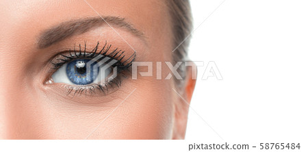 Close up photo of a woman's blue eye 58765484