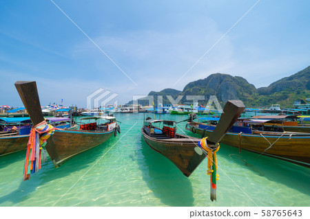 Boats in Phi Phi, Maya beach with blue turquoise Boats in Phi Phi, Maya beach with blue turquoise 58765643