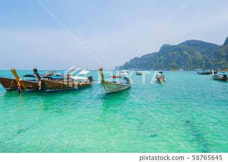 Boats in Phi Phi, Maya beach with blue turquoise Boats in Phi Phi, Maya beach with blue turquoise 58765645