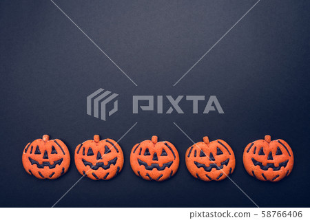 Dark background with halloween pumpkins. 58766406