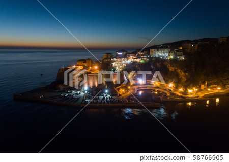 Aerial view of the old city of Ulcinj at night - the southernmost city of the Montenegro. Aerial view of the old city of Ulcinj at night - the southernmost city of the Montenegro. 58766905