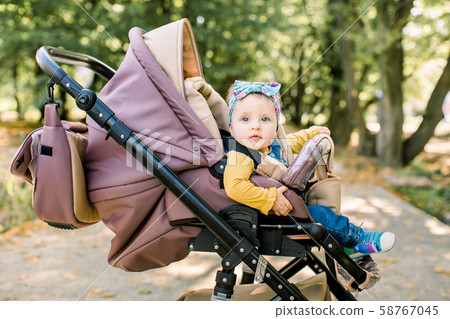 Cute little beautiful baby girl sitting in the. Stock Photo 58767045 PIXTA