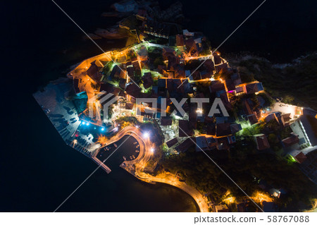 Aerial view of the old city of Ulcinj at night - the southernmost city of the Montenegro. Aerial view of the old city of Ulcinj at night - the southernmost city of the Montenegro. 58767088