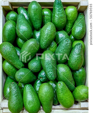 Selected ripe avocado boxes. boxes of avocado. Daylight. View from above. horizontal Selected ripe avocado boxes. boxes of avocado. Daylight. View from above. horizontal 58769593