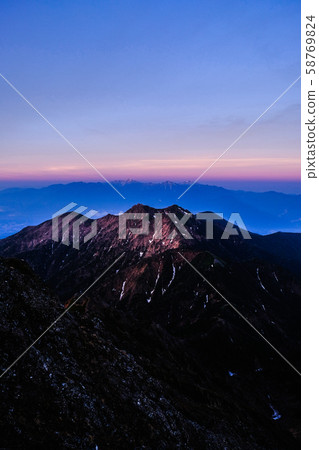 Spring Yatsugatake mountain climbing: Dawn at the summit of Mt. Akadake Spring Yatsugatake mountain climbing: Dawn at the summit of Mt. Akadake 58769824