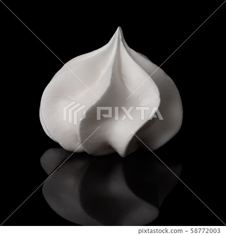 Meringue cookie isolated on black background with reflection. White merengue twisted bisquit. 58772003