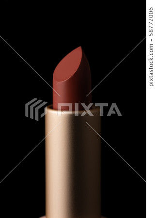 Red lipstick macro close-up isolated on black background. 58772006
