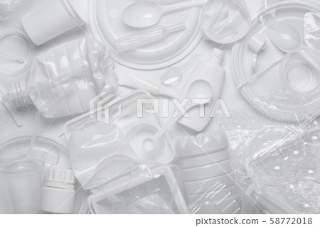 Plastic waste. White single-use plastic products garbage. Top view flat lay. 58772018